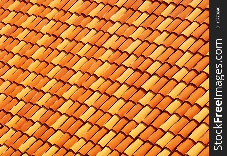 Rows of orange tiles on a roof.