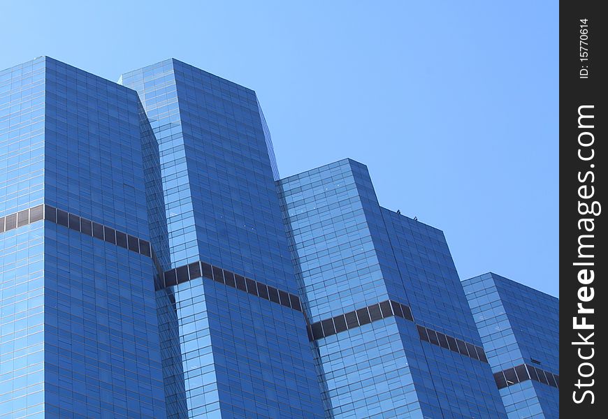 A Blue Glass Building against a blue sky. A Blue Glass Building against a blue sky