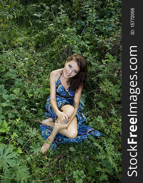 Outdoor portrait of young beautiful girl in summer brushwood. Outdoor portrait of young beautiful girl in summer brushwood.