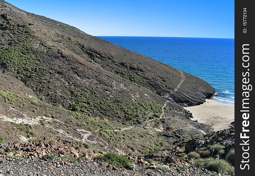 Old lava flow on beach, Andalusia, Spain