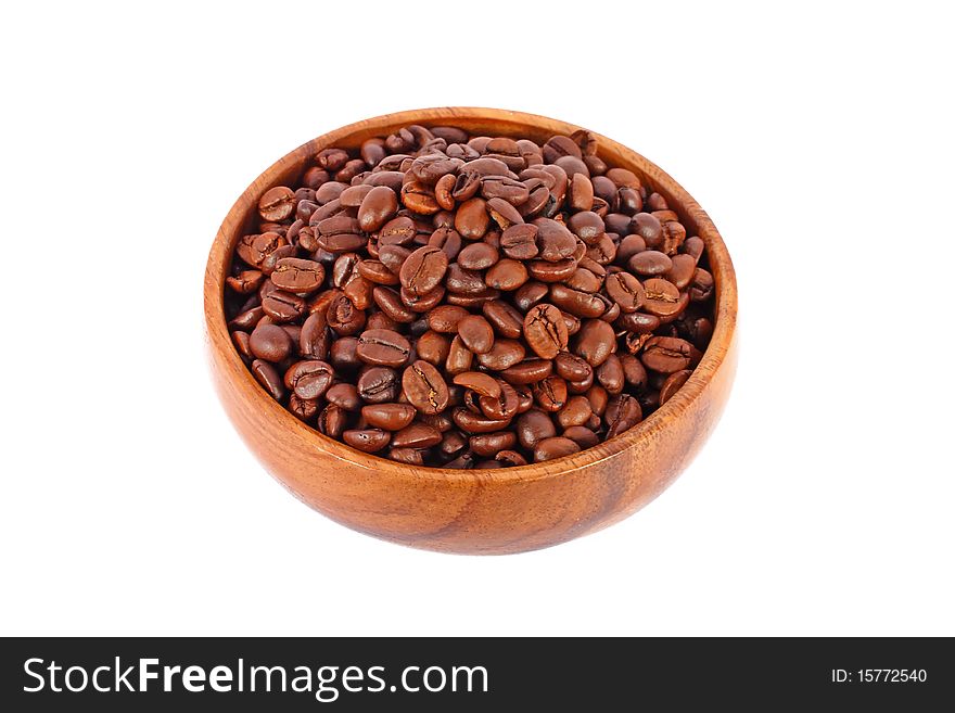 Coffee beans in wooden bowl isolated on white