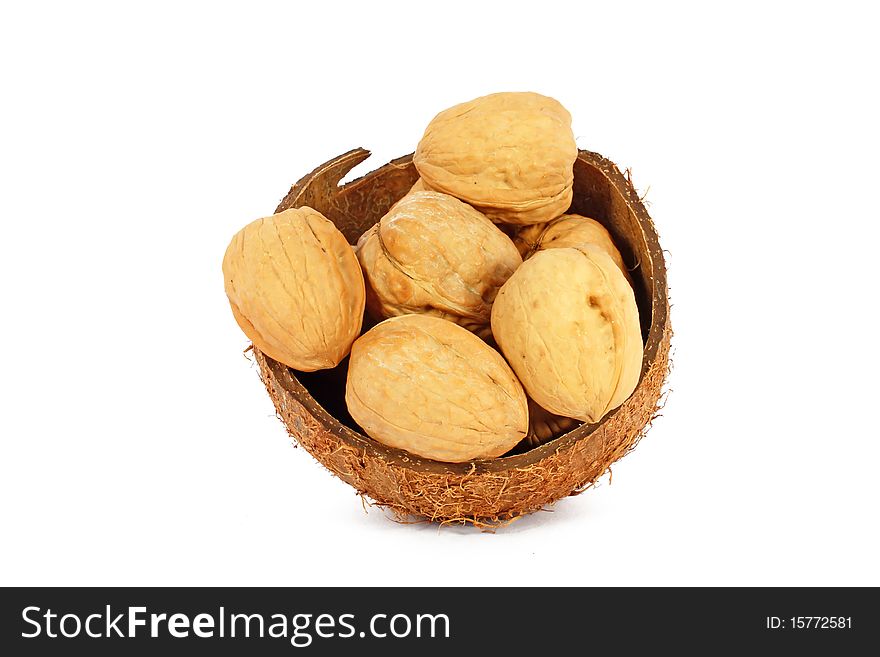 Walnuts in coco shell isolated on white