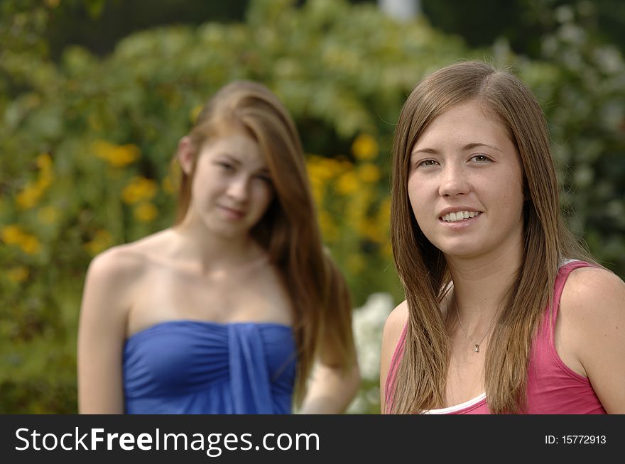 Two teenage girls spend some time outdoors. Two teenage girls spend some time outdoors.