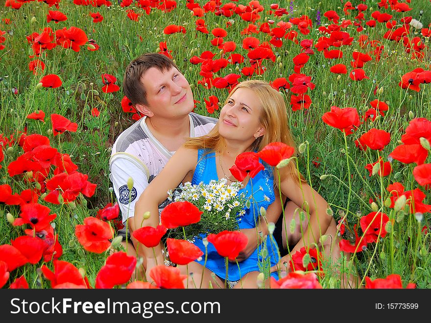 Loving couple in the meadow