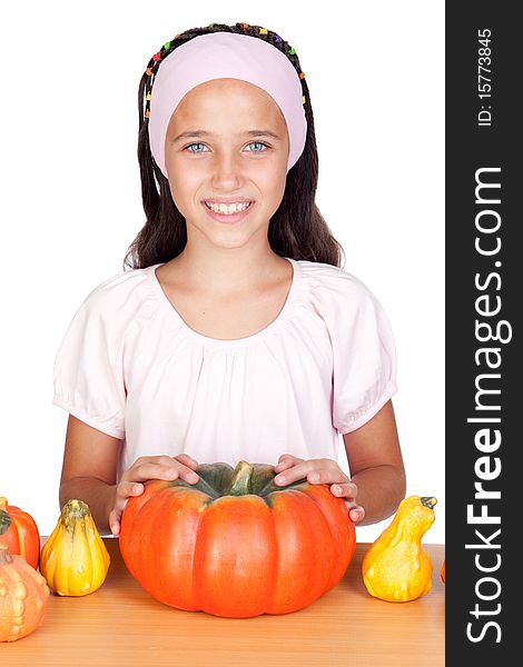 Happy girl in Halloween with a many pumpkins isolated on white background