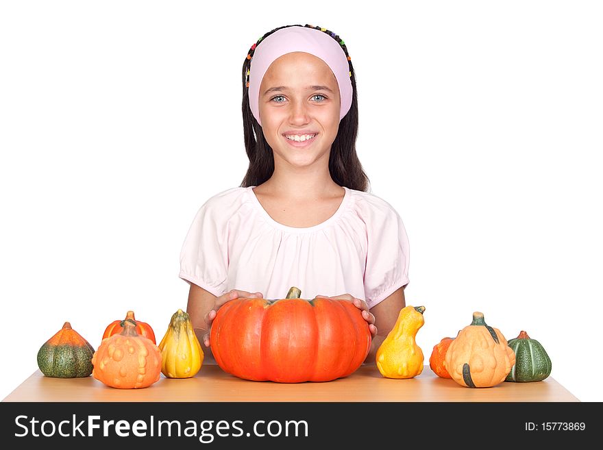 Happy girl in Halloween with a many pumpkins isolated on white background