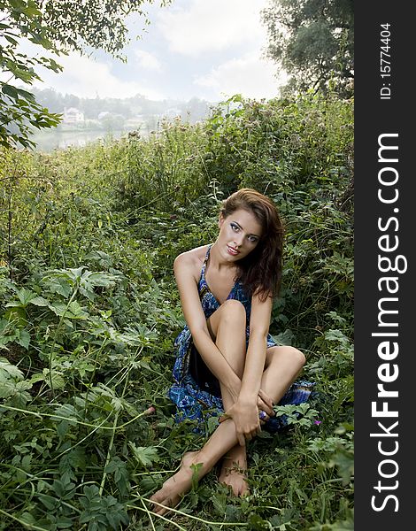 Outdoor portrait of young beautiful girl in summer brushwood. Outdoor portrait of young beautiful girl in summer brushwood.