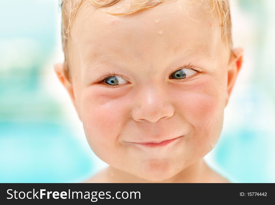 Portrait Of Smiling Sly Cute Boy