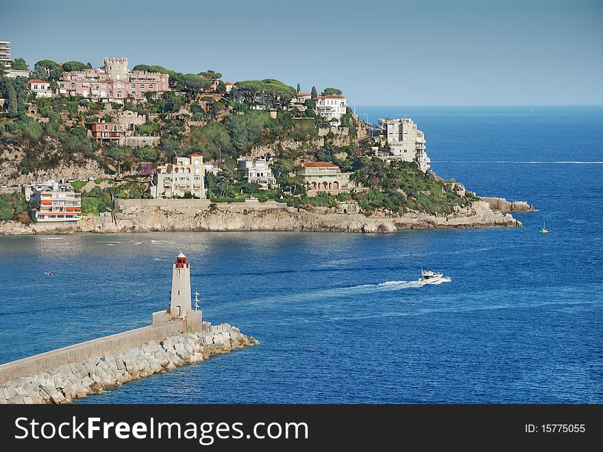 The harbour and beacon in port of Nice, France. The harbour and beacon in port of Nice, France.