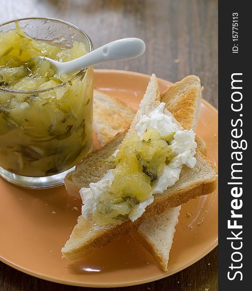 Toast with ricotta and apple jam on plate. Toast with ricotta and apple jam on plate