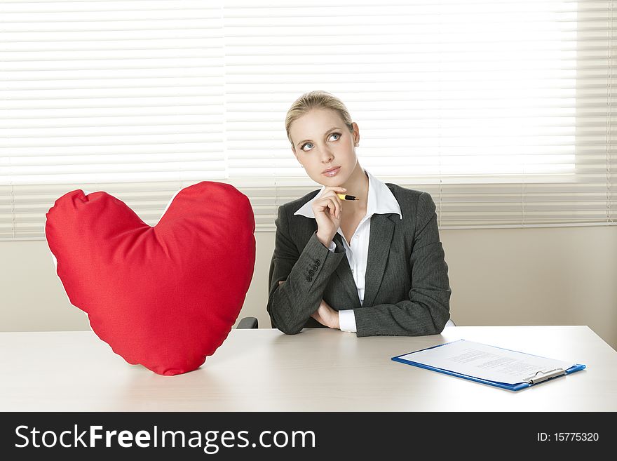 Young businesswoman dreaming of her Valentine date. Young businesswoman dreaming of her Valentine date