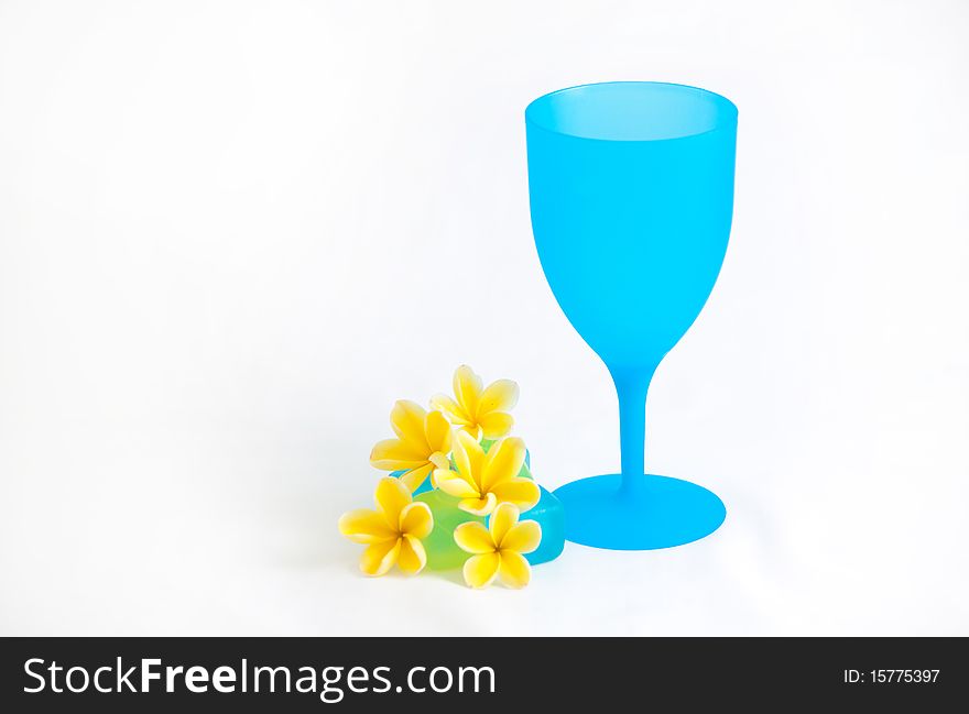 A arrangement for summer with a cooling cup of drink and plumeria flower. A arrangement for summer with a cooling cup of drink and plumeria flower.