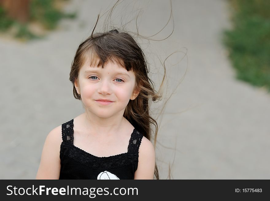 Adorable toddler girl with very long dark hair