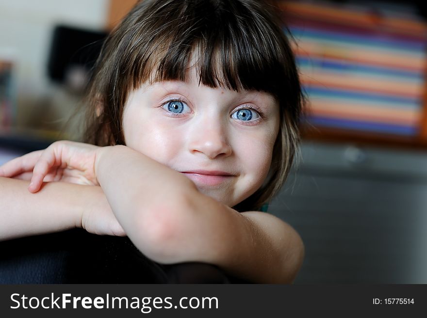 Nice toddler girl with blue eyes looking into the camera