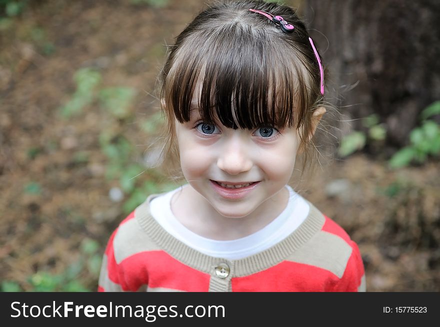 Nice toddler girl with blue eyes looking into the camera