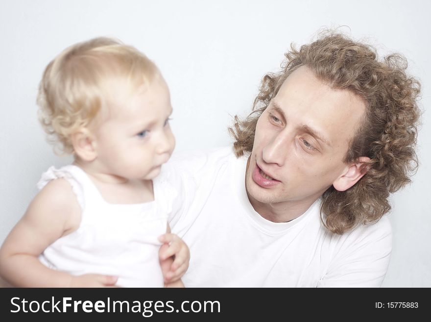 Curly head father and his little daughter. Curly head father and his little daughter