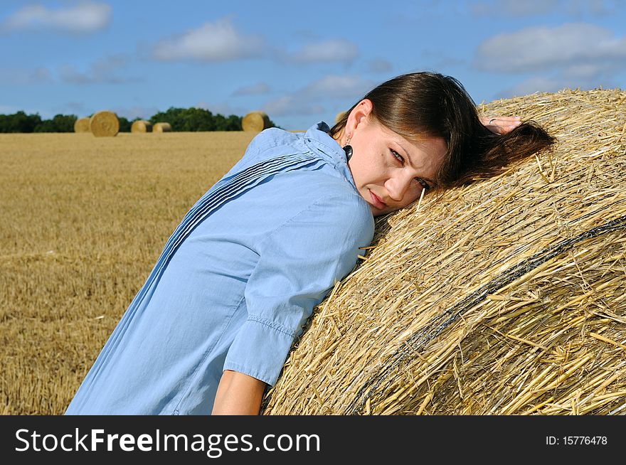 Young Woman Near The Straw Bales