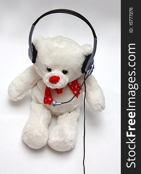 Bear and headphones on white background. Bear and headphones on white background.