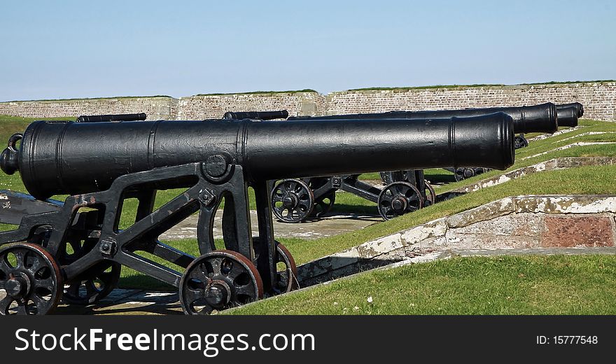 Old cannons looking out   from  the battlements of fort george invernesshire. Old cannons looking out   from  the battlements of fort george invernesshire