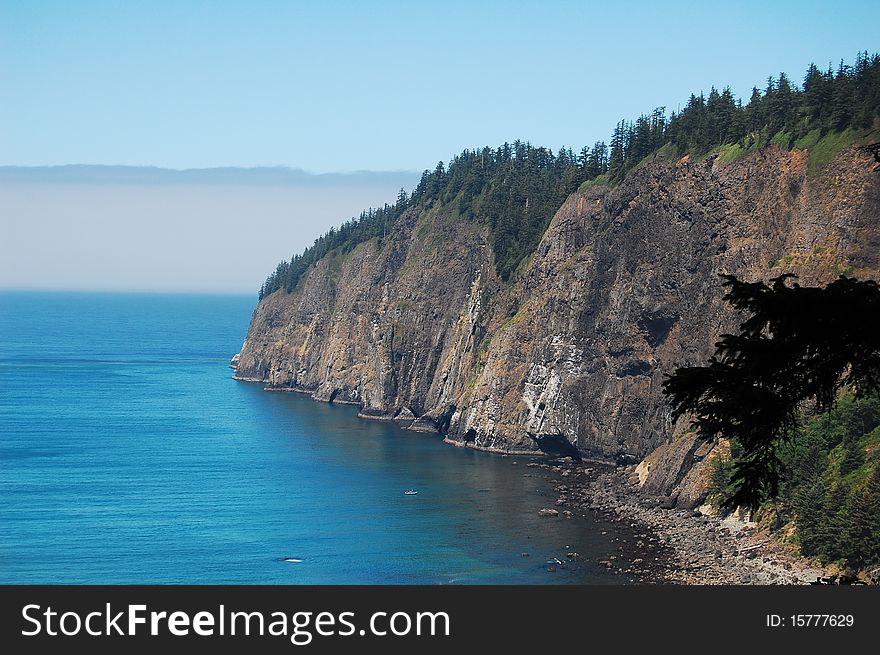 Cliffs on coast of oregon with fog rolling in. Cliffs on coast of oregon with fog rolling in