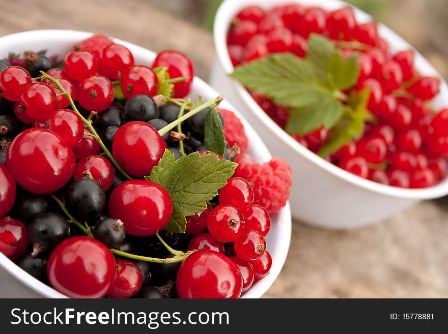 Mixed summer berries in a white bowl