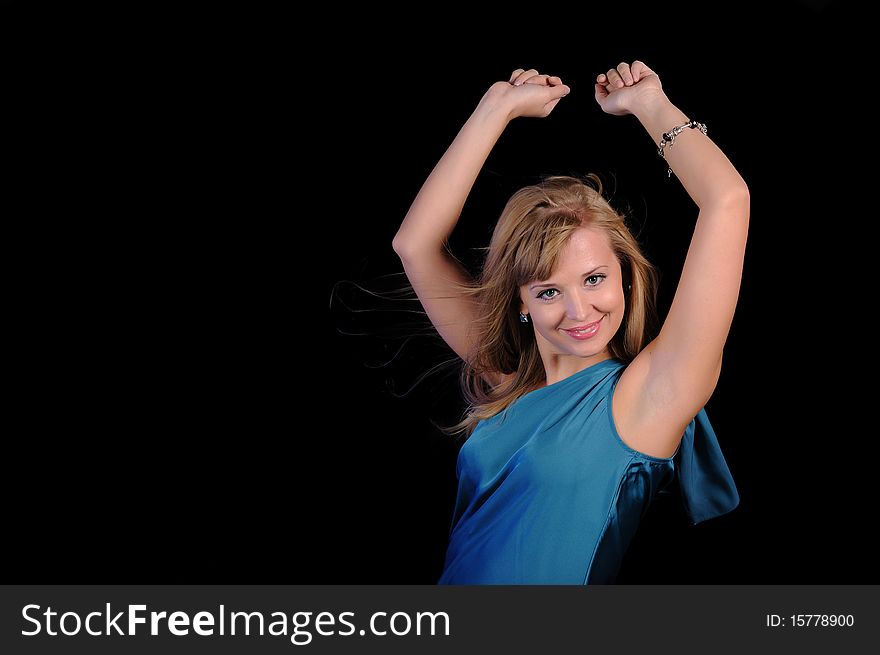 A young girl cheerfully spends time in a disco