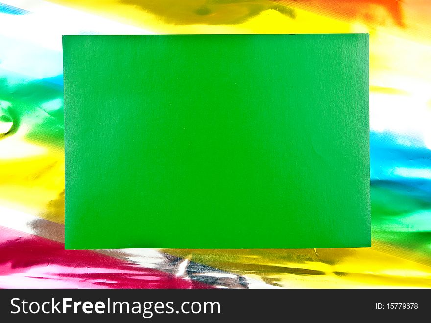 Green paper blank on colored background. Studio shot. Green paper blank on colored background. Studio shot