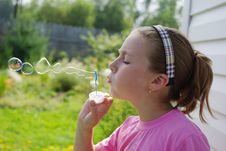Girl Blowing Soap Bubbles Stock Photography Girl Blowing Soap Bubbles Stock Photography