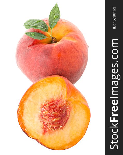 Close-up ripe peach with leaves, isolated on white
