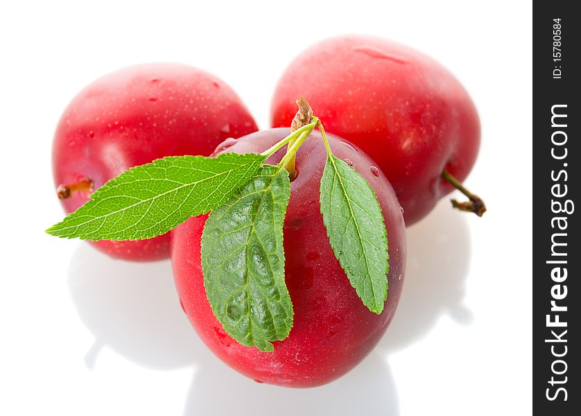 Three red ripe plums, isolated on white. Three red ripe plums, isolated on white