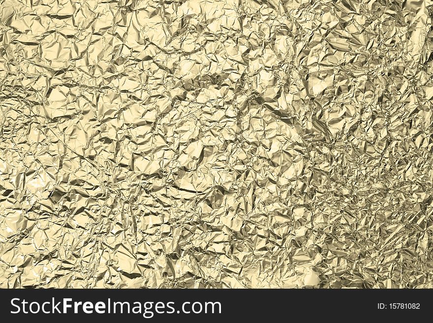 Pattern of Wrinkled Gold Aluminum Foil Paper using as background