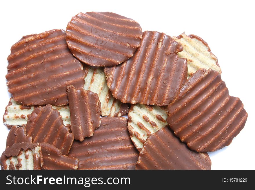 Ridged potato chips cover with Chocolate isolated on white. Ridged potato chips cover with Chocolate isolated on white