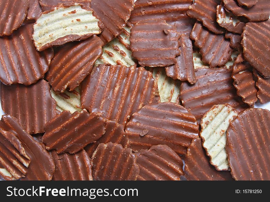 Pattern of Ridged potato chips cover with Chocolate using as background