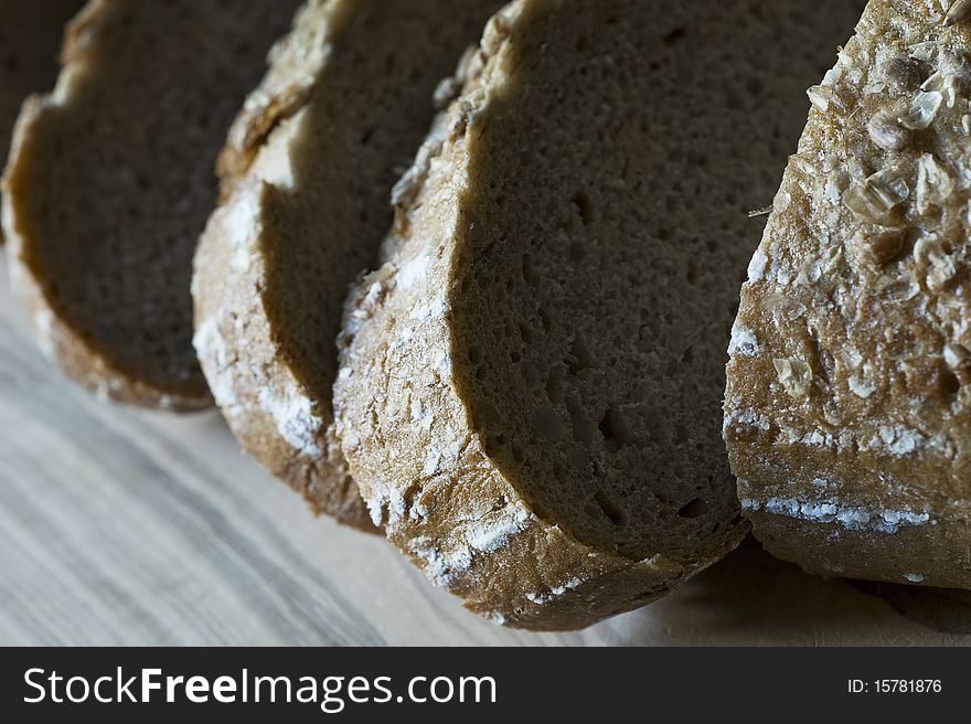Bread on a wooden cutting board, close-up, selective focus