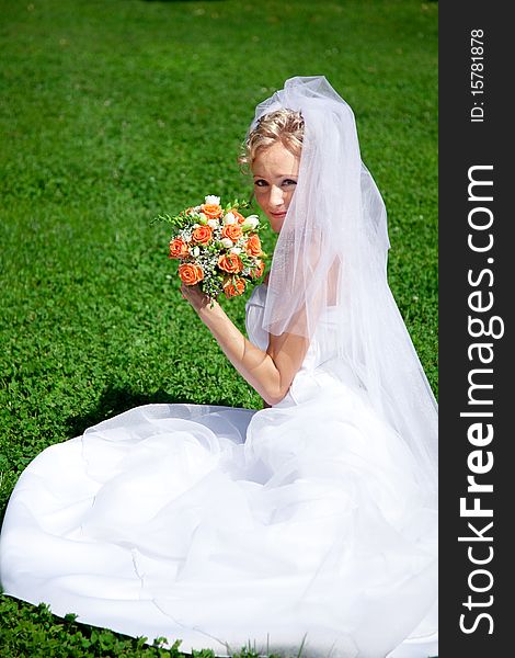 Young beautiful bride with wedding bouquet. Young beautiful bride with wedding bouquet