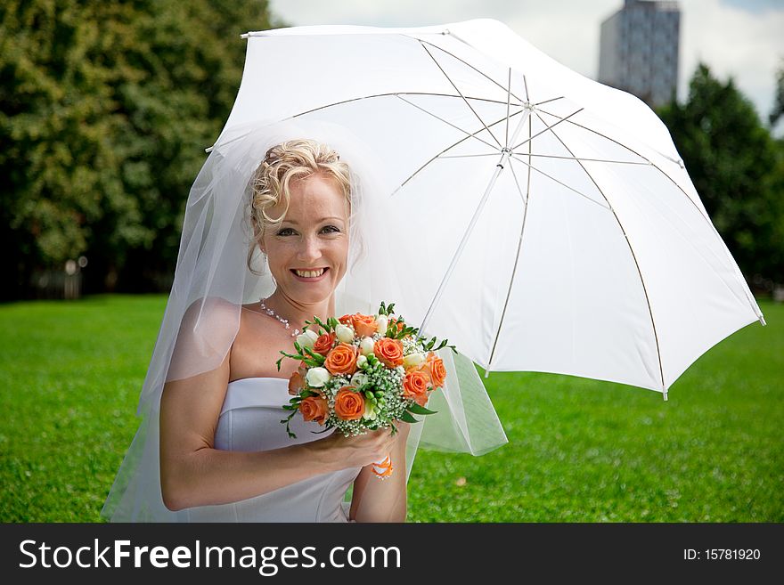 Young beautiful  bride with wedding bouquet. Young beautiful  bride with wedding bouquet