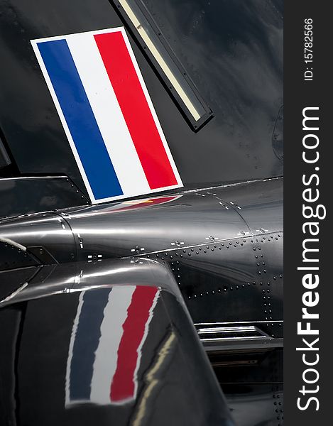 Flag of the netherlands and its reflection on an aircraft fuselage. Flag of the netherlands and its reflection on an aircraft fuselage