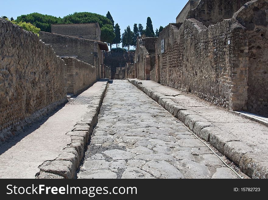 A paved road in Herculaneum at the foot of Mount Vesuvius. A paved road in Herculaneum at the foot of Mount Vesuvius