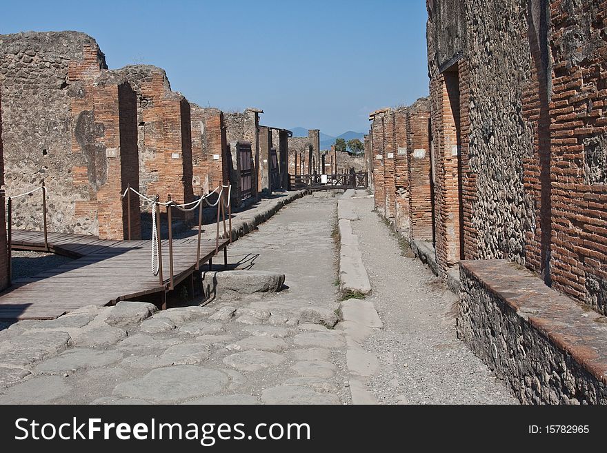 A street in the ruined town of Pompeii at the foot of Mount Vesuvius