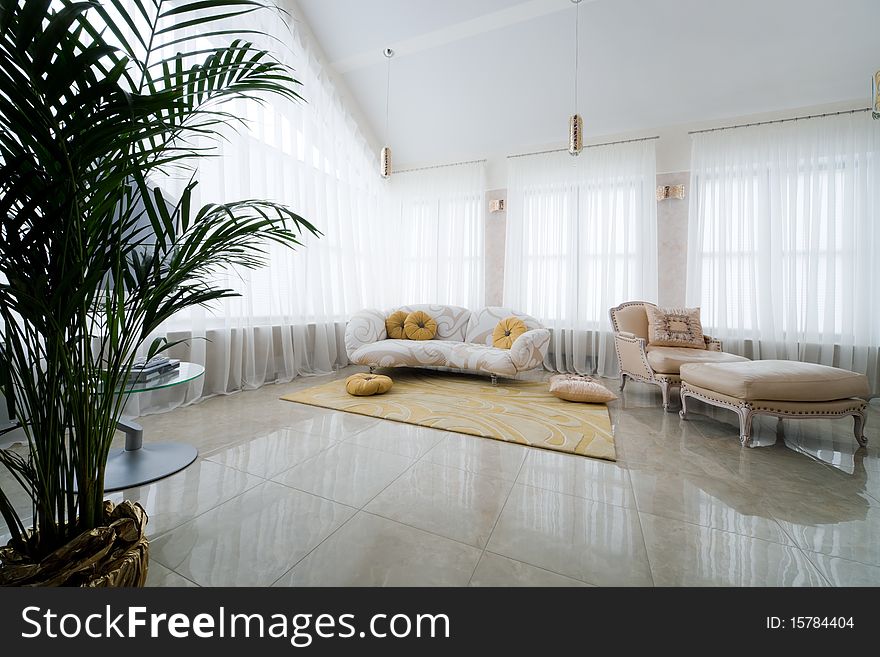 A beautiful armchair and sofa in modern apartment