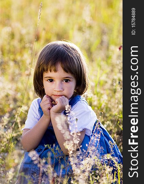 Portrait of a little girl in summer field. Portrait of a little girl in summer field