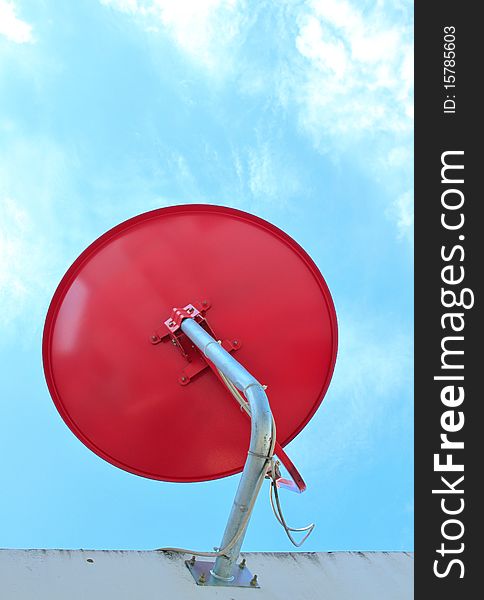 The red satellite dish with blue sky