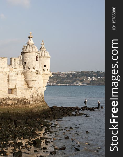 Torre de Belem Tower in Lisbon Portugal with Fisherman