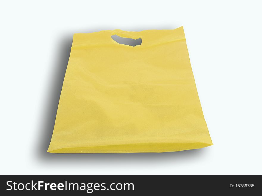 Yellow plastic bag isolated on white background
