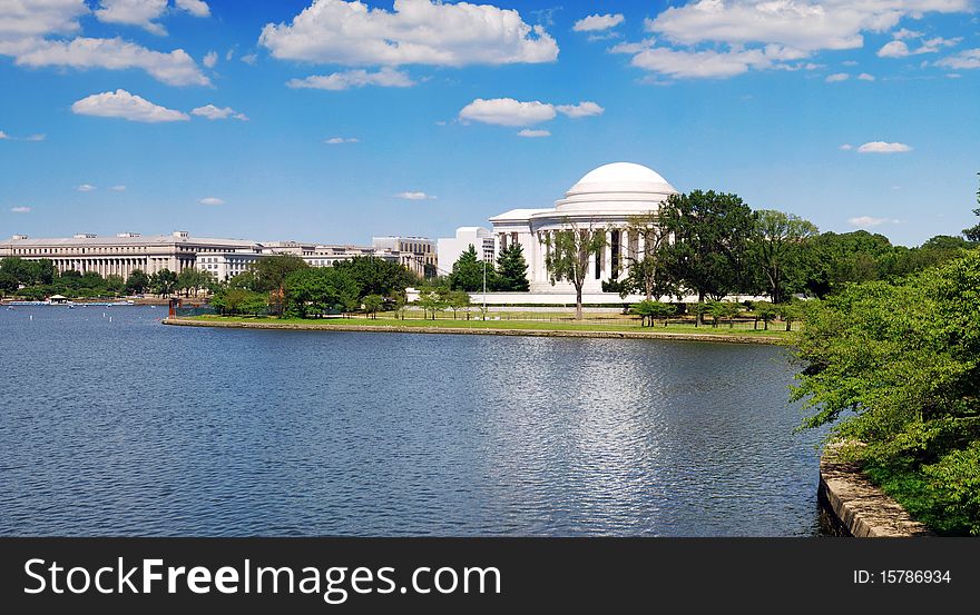 A high quality panorama stitched from 17 images - view of the Jefferson Memorial from across the Tidal Basin water reservoir.