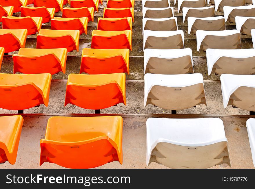 Orange and white seat in stadium