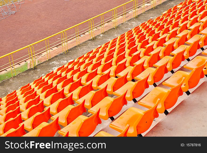 Orange and white seat in stadium