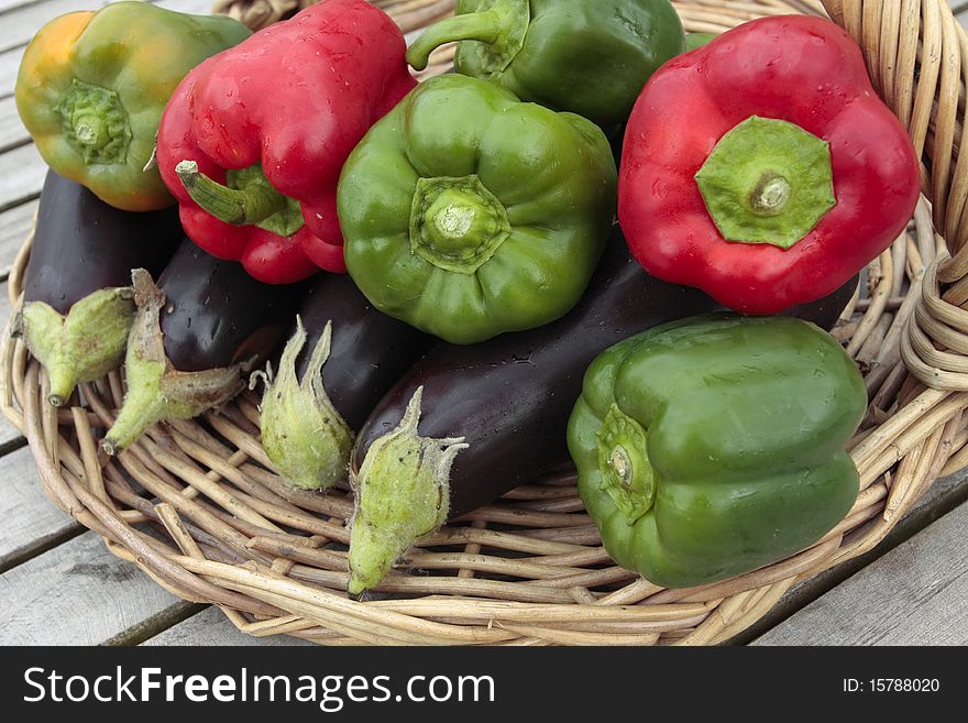 Ripe peppers and aubergine vegetables on  basket