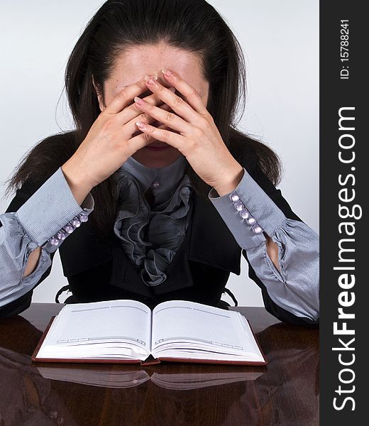 Businesswoman sitting at the desk stressed and have a problem. Businesswoman sitting at the desk stressed and have a problem