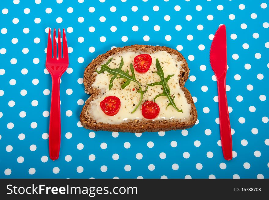 A healthy sandwich on a blue white dotted background